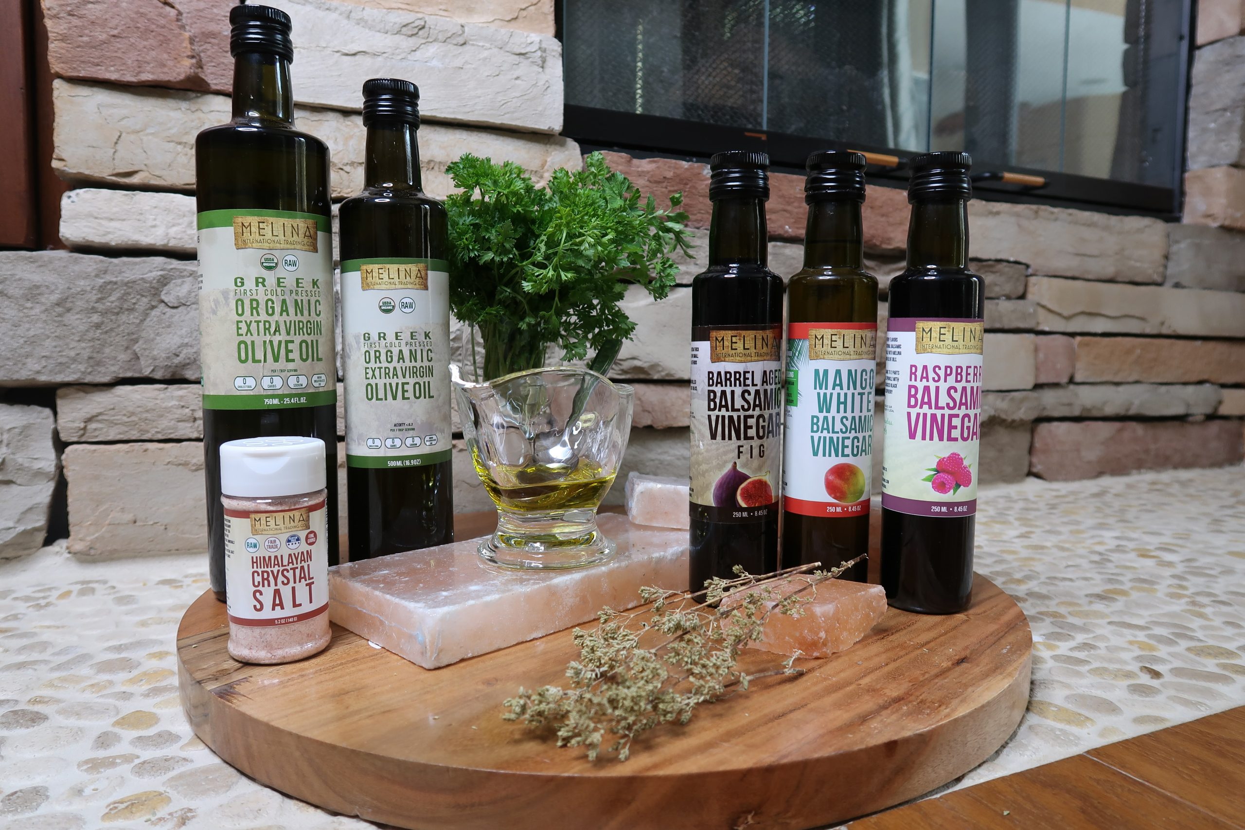 Selection of Melina Products including their Greek EVOO, balsamic vinegars, and salt